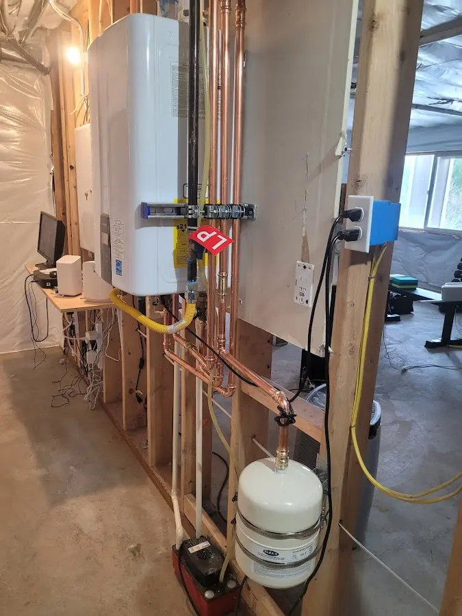 Licensed plumber repairing a kitchen sink in Coalinga